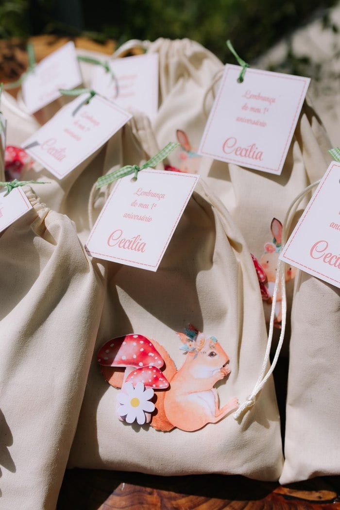 Personalized forest animal favor bags for Cecília's first birthday