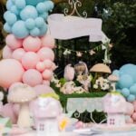 Pastel balloon and mushroom dessert display at Eva's enchanted fairy birthday party