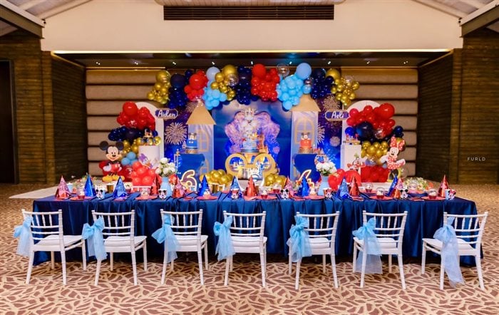Royal Mickey and Minnie desserts arranged on a mirrored gold tray