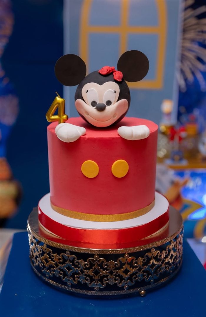 Donald Duck cookie and cupcake display on an ornate royal dessert stand