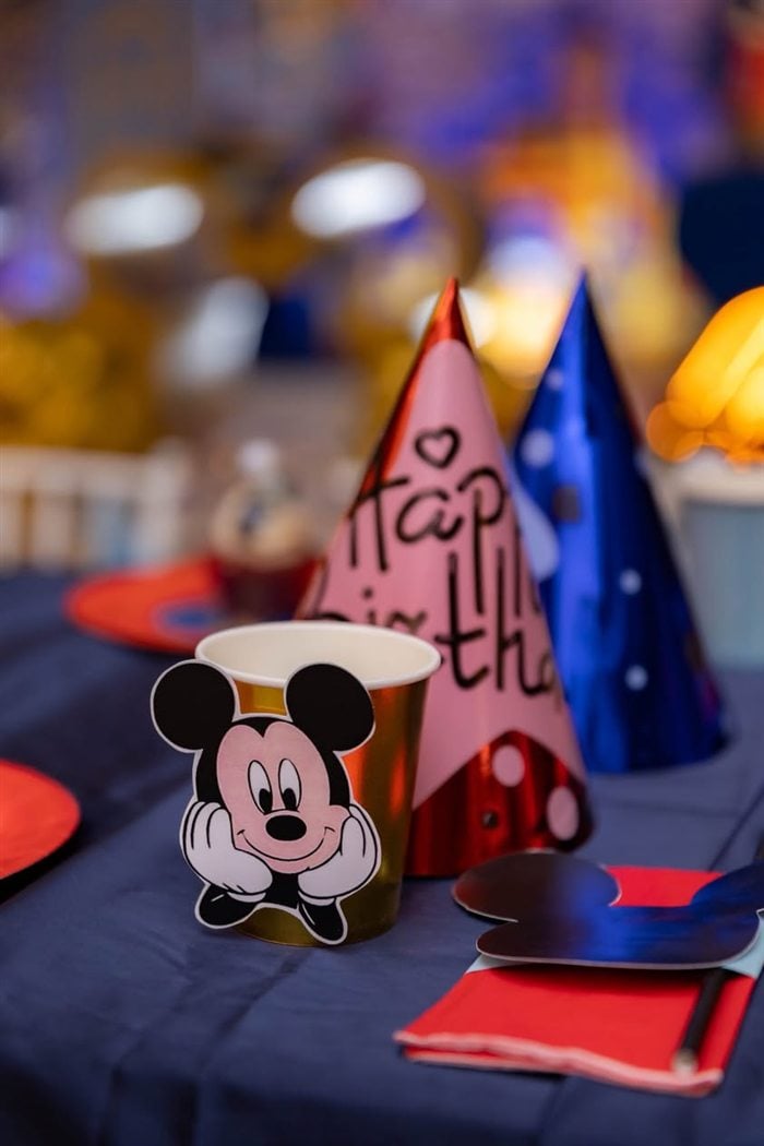 Donald Duck figurines personalized for Aiden on a royal party display