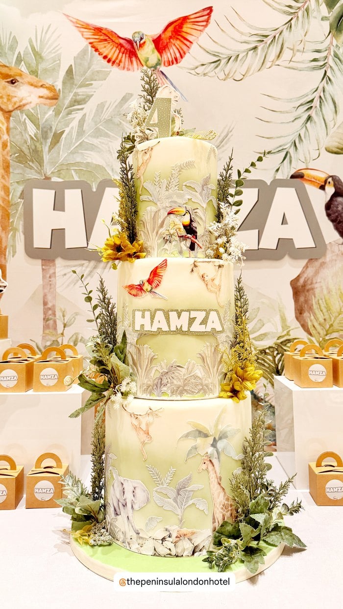 Personalized three tier jungle birthday cake with safari animal details