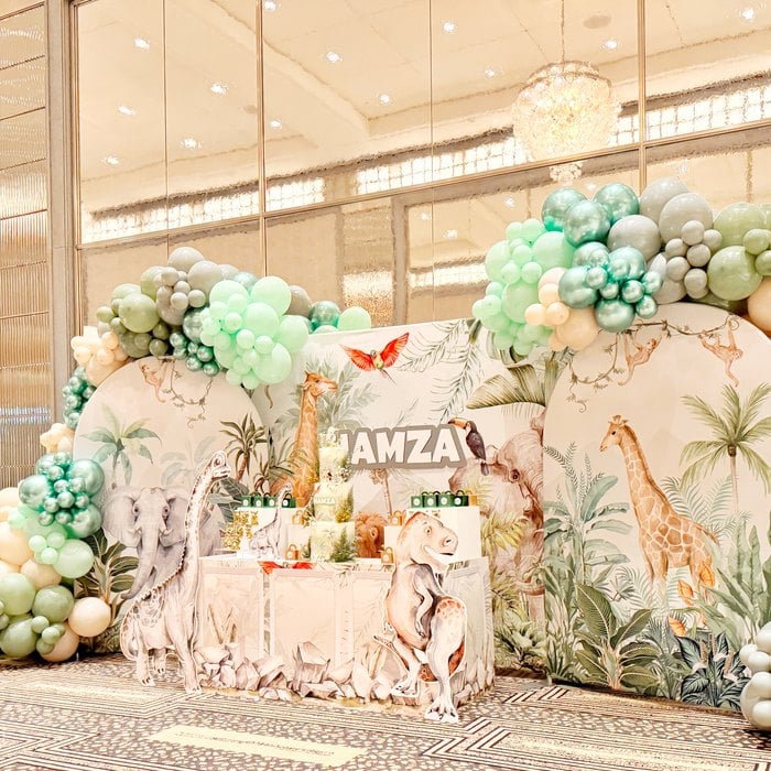 Wide view of the Jurassic safari birthday party backdrop