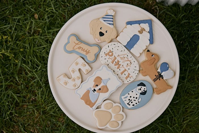 Platter of decorated dog and puppy birthday cookies
