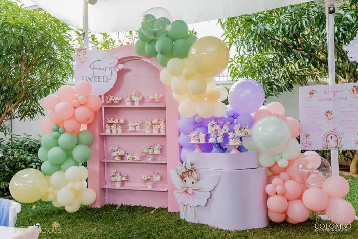 Pastel balloon garland and fairy favor display