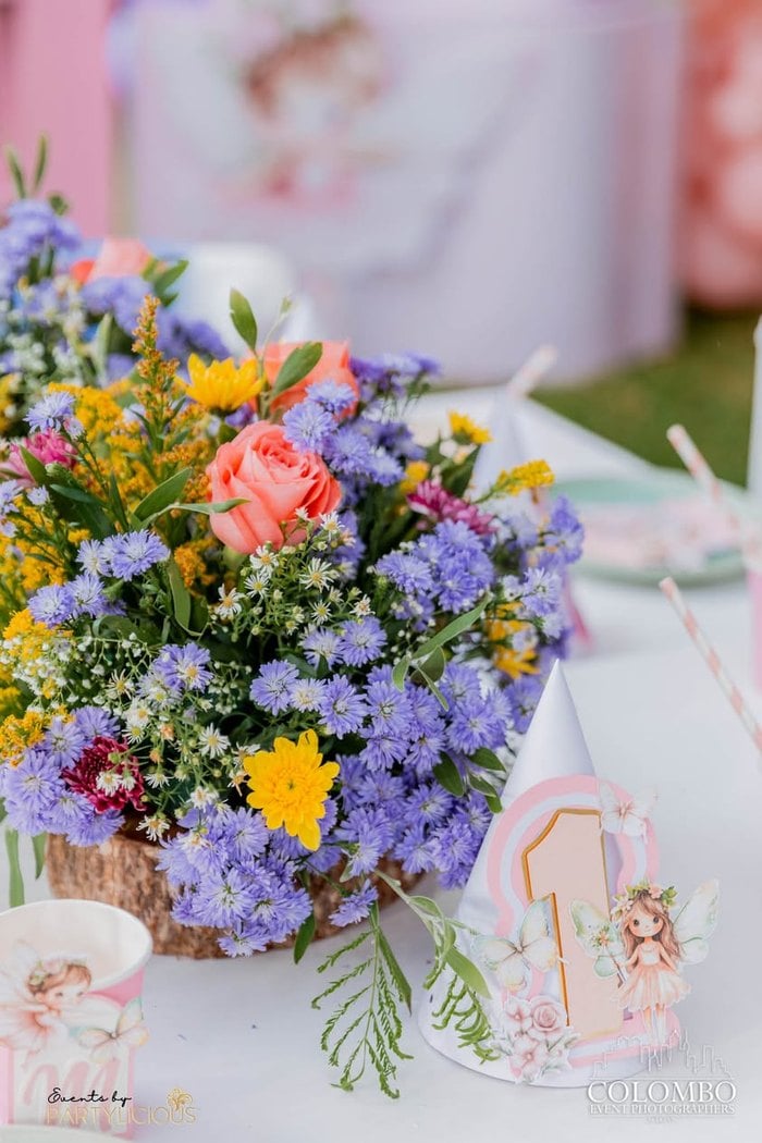 Colorful garden floral centerpiece with fairy details