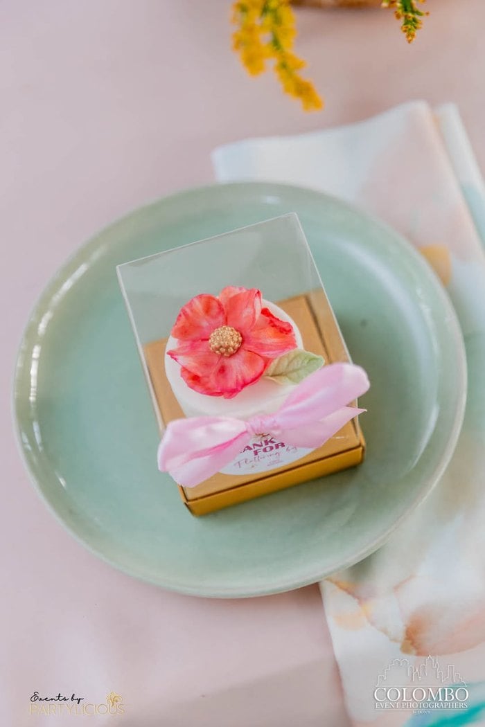 Flower cookie displayed at a fairy place setting
