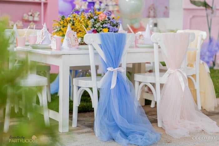 Blue and blush chair bows at the fairy party table