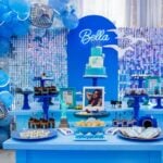 1989 Taylor Swift Inspired Birthday Party dessert table with blue balloons and shimmer backdrop