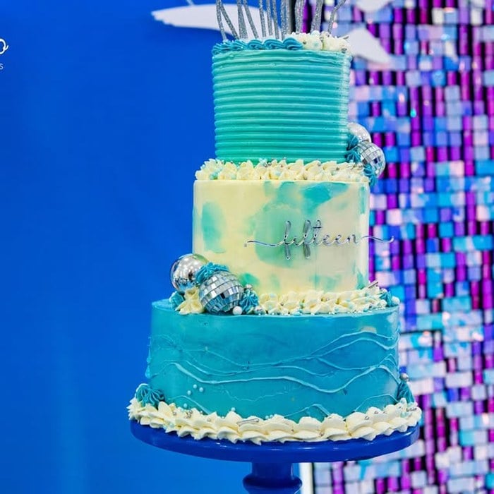 Blue ombre three-tier Taylor Swift 1989 birthday cake with Fifteen detail