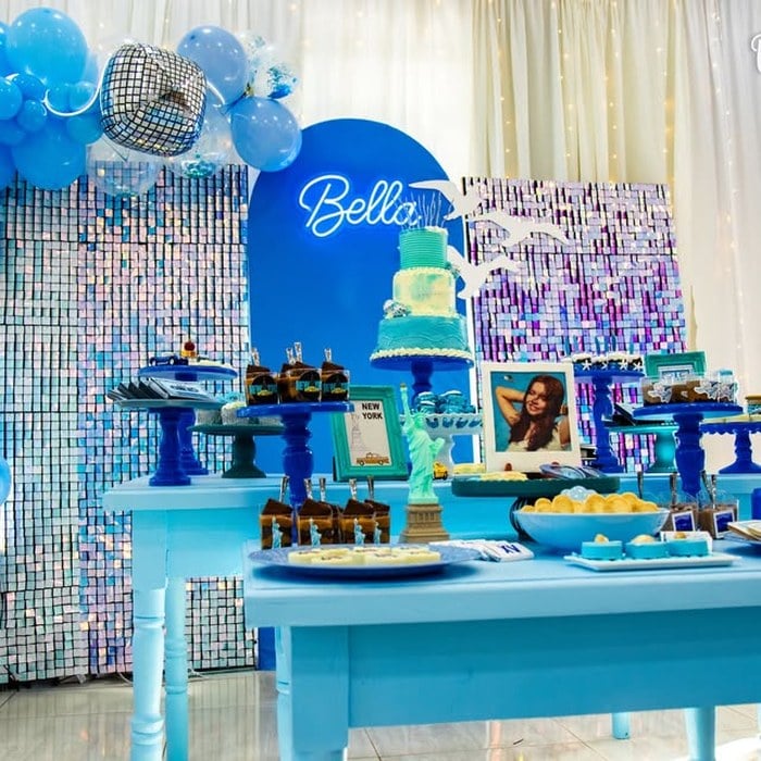 Full Taylor Swift 1989 dessert display with blue balloons and silver shimmer wall