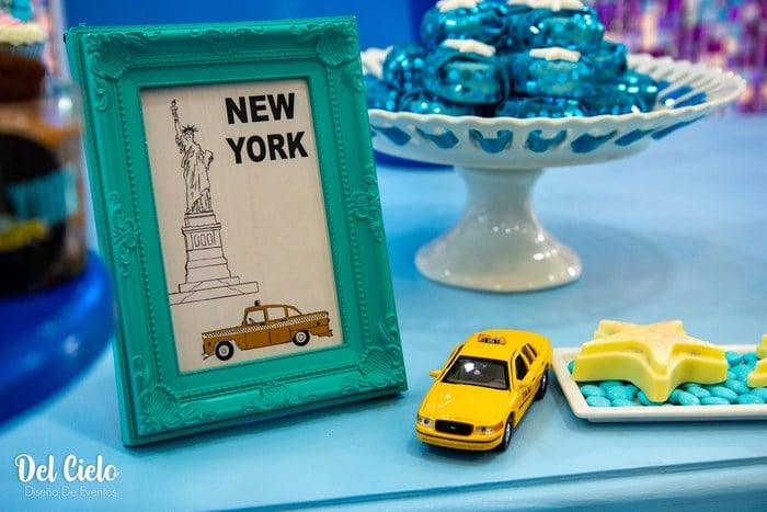 Framed New York sign with yellow taxi detail at a Taylor Swift 1989 party