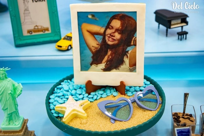 Polaroid-inspired beach dessert with sunglasses and starfish details
